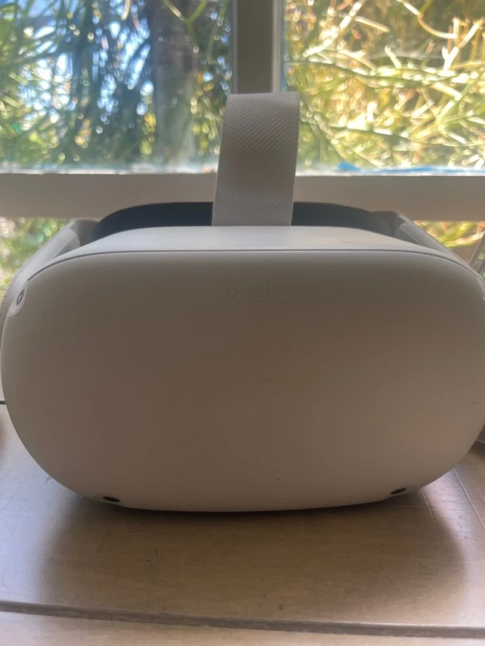 Oculus white standalone VR headset with white controllers and black face gasket